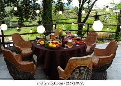 Breakfast food table for brunch on rustic wooden table in terrace restaurant – festive brunch set with meal variety – brunch set for picnic