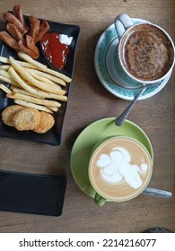 breakfast with french fries sausage nuget and drink black coffee and cafelatte