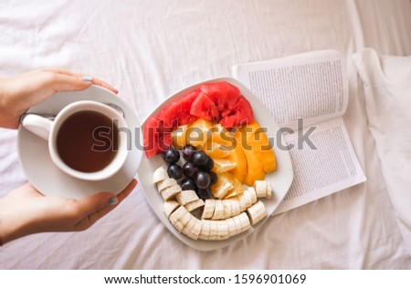 Similar – Hotcakes with fruit and coffee in bed