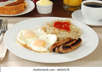 Breakfast With Link Sausage, Eggs, Hash Browns And Coffee