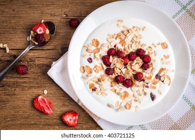 Breakfast Of Muesli And Berries. Cranberry In Heart Shape. Top View, Flat Lay