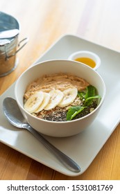 Breakfast Oatmeal With Peanut Butter, Banana Slices, Chia Seeds And Honey