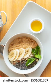 Breakfast Oatmeal With Peanut Butter, Banana Slices, Chia Seeds And Honey