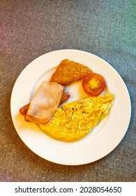 Breakfast With Omelet Sausage Hash Brown And Ham Slices 