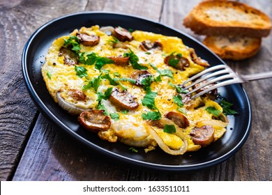 Breakfast - Omelette With Champignon On Wooden Background