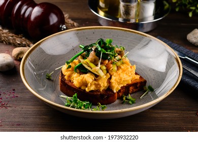 Breakfast Omelette With Champignon On Wooden Background, Toast With Omelet And Mushrooms. Scrambled Egg With Mushrooms On Toast. Food Recipe Background