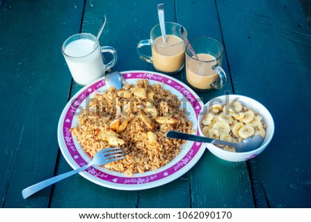 breakfast on the table. invigorating coffee and a plate of rice