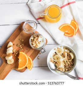 Breakfast On Wooden Table With Granola Top View