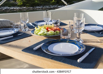 breakfast on yacht, dinning table on the upper deck in luxurious yacht.
