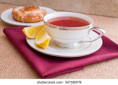 Breakfast with pastries, and hot tea with lemon.  - Shutterstock ID 347180978