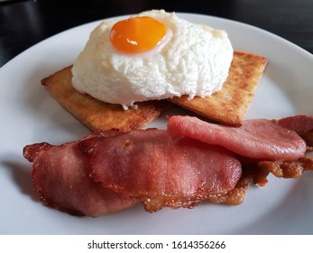 Breakfast Plate Of Cloud Egg On Irish Potato Bread And Grilled Bacon