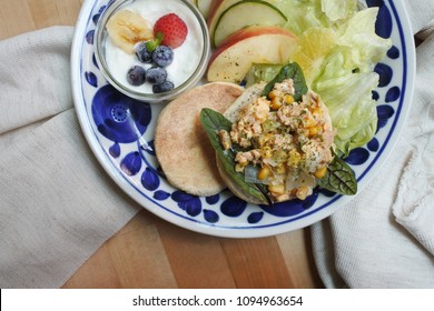 Breakfast Plate On  Wooden Table: Canned Tuna And Corn Scrambled Egg On English Muffin With Fruit Yogurt Salad