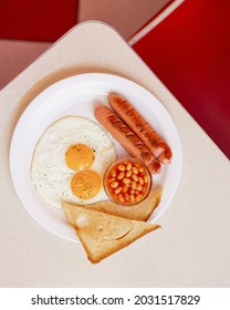 Breakfast Platter With Sausages, Eggs, Toast And Beans