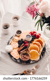 Breakfast Platter. Table Setting. Pancakes, Breakfast Sausages, Berries, Fruits, Chocolate Spread And Coffee. Morning Light. White And Grey Colors. Peonies. Summer Time. Sunday Brunch Party. Weekend