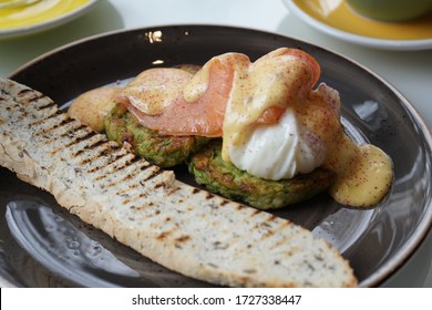 Breakfast With Poached Eggs, Salmon And Zucchini Fritters With Toast