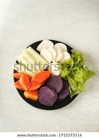 Breakfast salad in the morning, healthy for the body. Served on a black plate and selective focus images