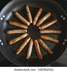 Breakfast Sausage Links Frying In A Pan