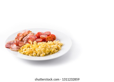 Breakfast with scrambled eggs, bacon and tomatoes isolated on white background. Copyspace