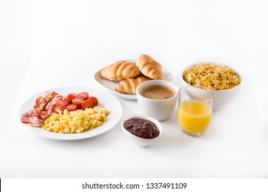 Breakfast With Scrambled Eggs, Bacon, Tomatoes,coffee,orange Juice ,croissant And Corn Flakes Isolated On White Background. 