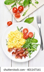 Breakfast With Scrambled Eggs, Bacon And Vegetables, Top View