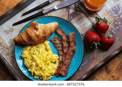 Breakfast With Scrambled Eggs,bacon, Croissant And Orange Juice On Wooden Tray, Overhead View