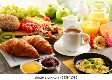 Breakfast served with coffee, orange juice, egg, rolls and honey. Balanced diet. - Shutterstock ID 533941396