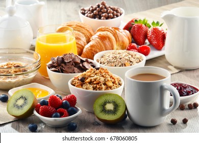 Breakfast served with coffee, orange juice, croissants, cereals and fruits. Balanced diet. - Shutterstock ID 678060805