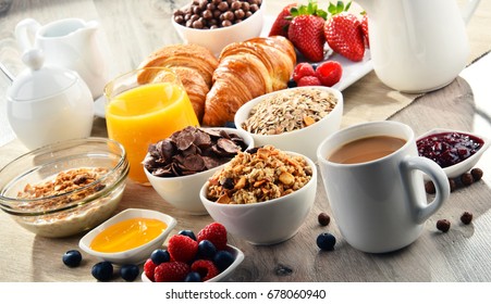 Breakfast served with coffee, orange juice, croissants, cereals and fruits. Balanced diet. - Shutterstock ID 678060940