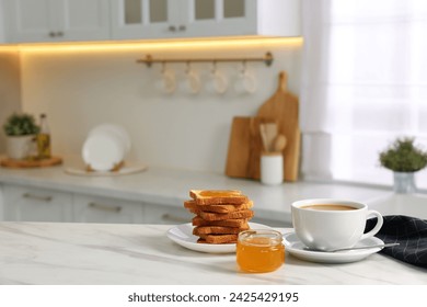 Breakfast served in kitchen. Fresh toasts, coffee and honey on white marble table. Space for text