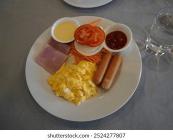 Breakfast set at morning time , food dish , delicious full english breakfast, egg, beans, sausages and bacon, some toasted bread slices, fruit and a cup of coffee. - Powered by Shutterstock