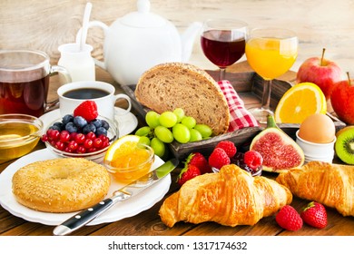 Breakfast table with bread and fruits with beverages - Shutterstock ID 1317174632