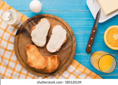 Breakfast Table With Bread, Milk Butter, Fruits And Juice. Top View.