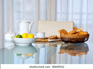 Breakfast Table With Coffee Cup And Bread Basket