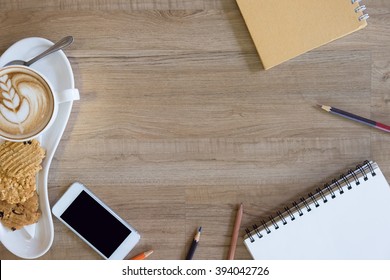 Breakfast Table With Mobile Phone , Coffee Cup And Cookies And Top View With Copy Sapce