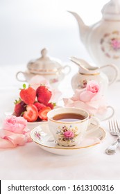 Breakfast With Tea, Croissants And Fresh Strawberries Served With Fine China Porcelain Set With Roses