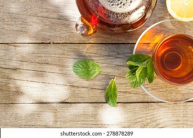 Breakfast Tea On Table In Sunny Garden. Top View With Copy Space