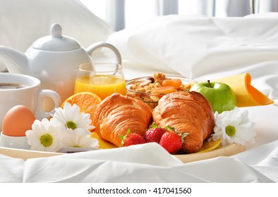 Breakfast Tray In Bed In Hotel Room. 