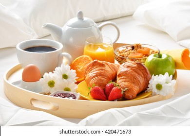 Breakfast Tray In Bed In Hotel Room. 