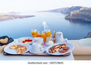breakfast for two with coffee, fresh orabge juice and yogurt at morning by seaside
