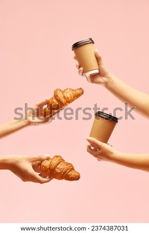 Breakfast for two. Human hands holding croissants and coffee cups to go over pink background. Concept of food, bakery, breakfast ideas, taste, freshness. Poser. Copy space for ad