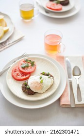 Breakfast For Two Mexican Style Black Bean Cakes With Fried Eggs And Sliced Tomatoes