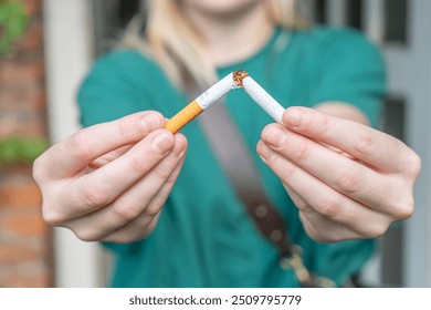 Breaking a Cigarette in Half. Smoking a broken Cigarette. Man and woman smoking a broken cigarette. Stop smoking. Quitting cigarettes. - Powered by Shutterstock