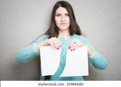 Breaking Contract. Furious Young Woman Tearing Up Paper 