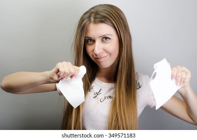 Breaking contract. Furious young woman tearing up paper