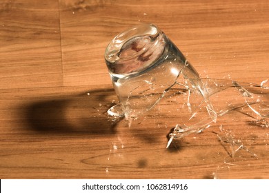 Breaking Of A Glass On A Wood Floor 