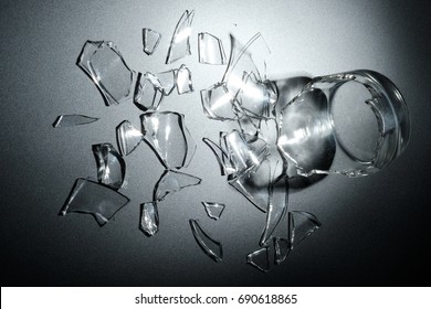 A Breaking Glass Of Water On The Black Background