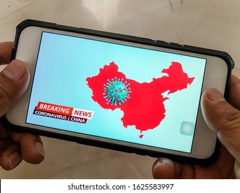 Breaking News On Mobile Phone Highlighting Coronavirus Outbreak In China. Coronavirus Also Known As Covid 19 Is A Deadly Flu Virus Detected In Wuhan, China.