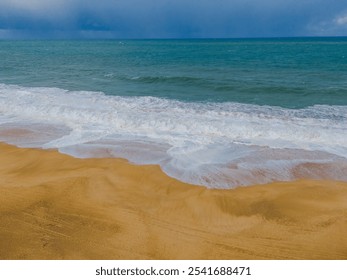 Breaking waves at Nazare beach on the Portugal coastal town on the Atlantic ocean shore. Aerial drone view - Powered by Shutterstock