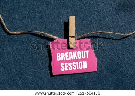 Breakout session message written on ripped torn pink paper piece with gray background. Conceptual breakout session symbol. Copy space.