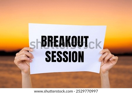 Breakout session message written on white paper with blurry lake background. Conceptual breakout session symbol. Copy space.